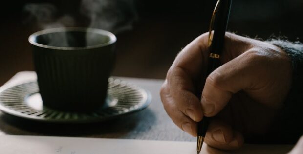 a person making a handwritten letter
